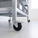 100mm black rubber braked bolt hole castors on a galvanised steel storage rack