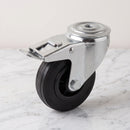 100mm braked castor with black rubber on polypropylene wheel, top view of the 12mm bolt hole