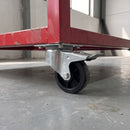 100mm braked top plate castor with black rubber wheel under a red steel tool cabinet in a workshop