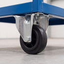 100mm fixed castor with black rubber wheel bolted under a blue steel warehouse trolley