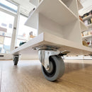 100mm noise-reducing braked castor grey rubber wheel under a white shop display stand