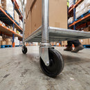 100mm swivel castor with black polypropylene wheel fitted to a warehouse trolley