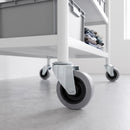 100mm grey rubber swivel bolt hole castor fitted to a white steel retail stock trolley