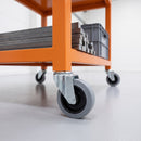 100mm grey rubber bolt hole castors on an orange steel tool and material cart