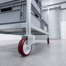 100mm red polyurethane swivel castor fitted to a galvanised steel platform trolley