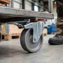 Dark Gray 100mm Pressed Steel Swivel Castor with Brake - Grey Cast Iron Wheel & 4-Hole Plate - 140kg Max Load