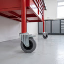 125mm braked grey rubber bolt hole castor on a red steel mobile tool chest