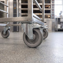 125mm braked top plate castor with grey TPR wheel under a stainless steel bakery rack trolley on a resin floor