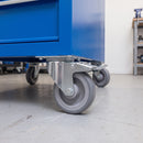 125mm braked top plate castor with grey TPR wheel under a blue steel workshop tool cabinet