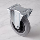 125mm fixed top plate castor grey rubber wheel 100kg, high angle view on grey marble