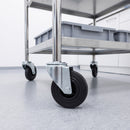 125mm black rubber swivel bolt hole castor fitted to a stainless steel lab cart leg