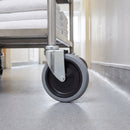 125mm swivel castor grey rubber on polypropylene wheel M10 bolt hole on a hotel linen cart