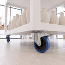 160mm blue non-marking braked castor on a mobile retail display unit