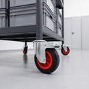 160mm black rubber braked bolt hole castors on a dark grey steel warehouse trolley