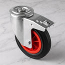 160mm braked swivel castor with black rubber wheel, red centre, foot brake and 12mm bolt hole