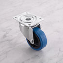 160mm swivel top plate castor blue non-marking rubber wheel 300kg on grey marble
