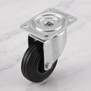 160mm swivel top plate castor black rubber wheel 150kg, high angle view on grey marble
