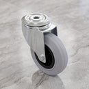 160mm swivel castor with grey rubber on polypropylene wheel and roller bearing, top view of the 12mm bolt hole