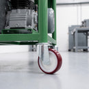 160mm red polyurethane bolt hole castor on a green steel machine base carrying a compressor
