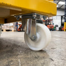 160mm swivel castor with white nylon wheel bolted with nuts under a yellow material handling cart