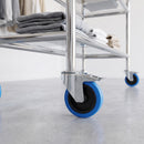 200mm blue non-marking braked bolt hole castor on a chrome retail display stand