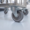 200mm braked top plate castor with grey TPR wheel under a stainless steel laundry trolley on a resin floor