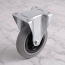 200mm fixed top plate castor grey rubber wheel 200kg, high angle view on grey marble