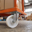200mm swivel castor with white nylon wheel bolted with nuts under an orange warehouse trolley