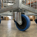 100mm swivel top plate castor with blue non-marking rubber wheel bolted under a galvanised roll cage trolley