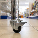 50mm braked bolt hole castor fitted to a shop display stand tube leg