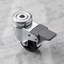 50mm braked swivel bolt hole castor with black polypropylene wheel on light grey marble, high-angle three-quarter view
