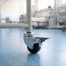 50mm braked bolt hole castor fitted to a medical trolley tube leg