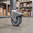 50mm braked grey rubber bolt hole castor fitted to a warehouse picking trolley