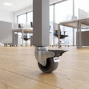 50mm braked grey rubber bolt hole castor fitted under a square tube leg in an office