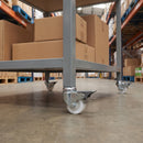 50mm braked white nylon bolt hole castor fitted to a warehouse picking trolley