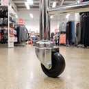 50mm black polypropylene swivel castor fitted to a shop display stand