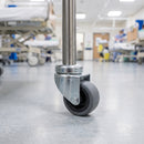 50mm grey rubber bolt hole castor fitted to a medical trolley tube leg