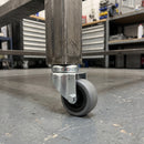 50mm grey rubber bolt hole castor fitted to a mobile workbench square tube leg