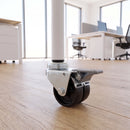 50mm black twin wheel braked swivel castor with M10 bolt hole fitted to an office furniture tube leg