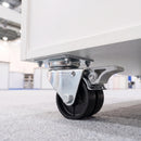 50mm twin wheel braked top plate castor bolted under a white exhibition counter