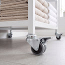 50mm twin wheel braked bolt hole castor with grey rubber wheels fitted to a retail display stand leg