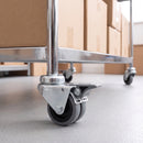 50mm grey rubber twin wheel braked swivel castor with M10 bolt hole on a retail cart