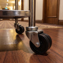 50mm twin wheel bolt hole castors fitted to the tube legs of a hotel room service trolley
