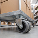 50mm twin wheel grey rubber top plate castor bolted under a retail stockroom trolley