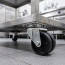 50mm twin wheel top plate castor bolted under a stainless steel catering trolley in a commercial kitchen