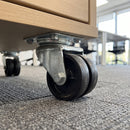 50mm twin wheel top plate castor bolted under a mobile office drawer pedestal