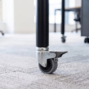 60mm braked swivel bolt hole castor with grey rubber wheel fitted to an office desk tube leg