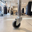 60mm swivel bolt hole castor fitted to a shop display stand