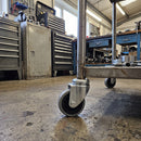 60mm swivel castor with grey rubber wheel fitted to a workshop tool trolley