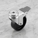 75mm braked swivel bolt hole castor with black polypropylene wheel on light grey marble, high-angle three-quarter view